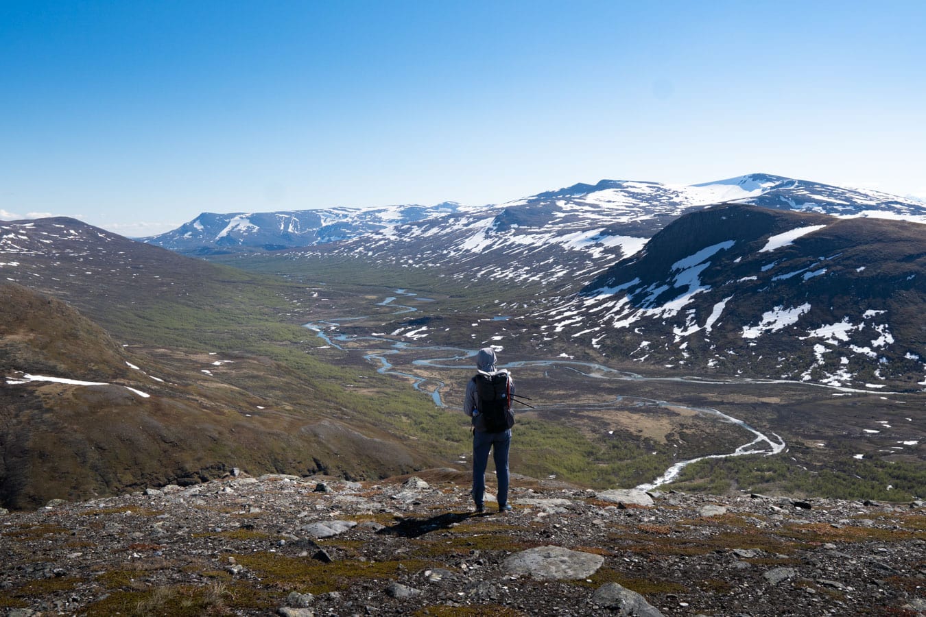 Ultralight hiker overlooking a view in Nordics
